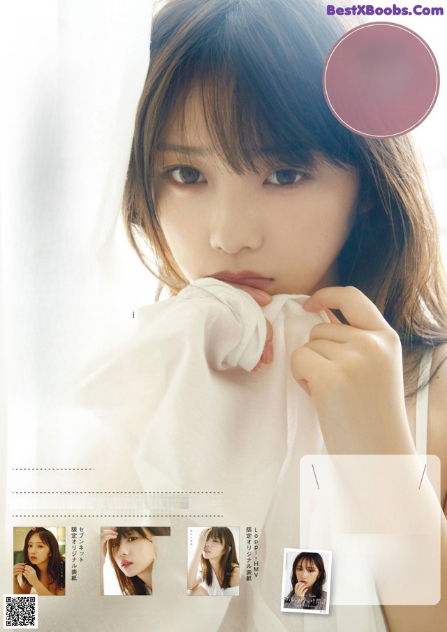 A woman in a white shirt is posing for a magazine cover.