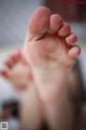 A close up of a person's feet with a blurry background.