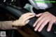 A woman's hand with a blue manicure on her nails.